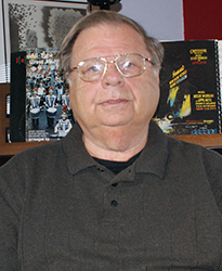 Mike Kahsar sitting at his Allen Theatre Organ.