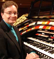 Picture of organist, Trent Sims sitting at the console of the Albee Wurlitzer pipe organ at Cincinnati Music Hall Ballroom