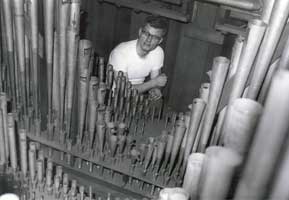 Photo of Ron in the organ chamber