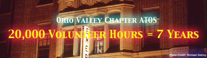 Graphic banner reads Ohio Valley Chapter ATOS 20,000 volunteer hours equals 7 years. Emery Theatre facade behind text