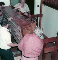 Photo of volenteers carry a pipe chest