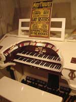 Photo of 2 manual console with movie poster on music rack