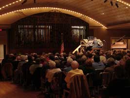 Ron Rhode playing the Mighty Wurlitzer as over 600 attendees looked on.