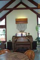 photo console with chimes hanging above